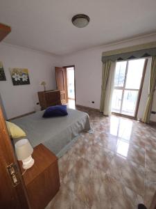 a bedroom with a bed and a large window at Casa Adora in Santa Ursula im Norden Teneriffas in Santa Úrsula +10 photos
