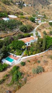 an aerial view of a house on a hill at Casa rural Benthomiz 210, Algarrobo, Málaga, España in Algarrobo