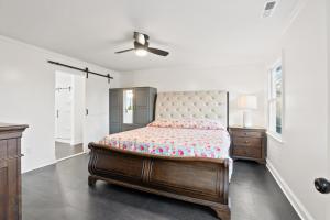 a bedroom with a bed and a ceiling fan at Blue Mountain Song- Massanutten Home with Hot tub! in Hopkins Spring