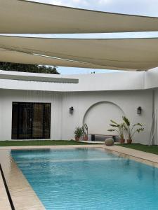 a swimming pool in the backyard of a house at Hatta Valley Lodge in Hatta