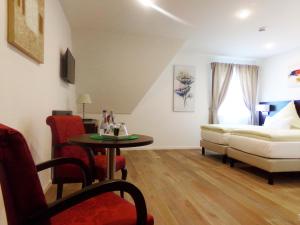 Postel nebo postele na pokoji v ubytování Hotel im Ried