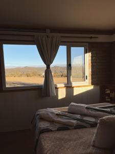 Ένα ή περισσότερα κρεβάτια σε δωμάτιο στο Terraza de Amancay