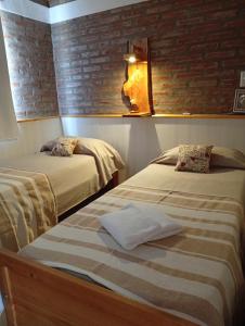 Ένα ή περισσότερα κρεβάτια σε δωμάτιο στο Terraza de Amancay