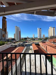 a view of a city from a balcony at Por do Sol Praia Hotel in Fortaleza