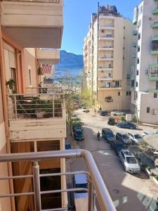 an apartment balcony with a view of a street at Roxy's house in Vlorë