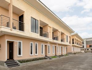 an exterior view of a building with balconies at Waterfront Villas And Wellness SPA in Warri