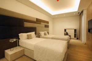 Ein Bett oder Betten in einem Zimmer der Unterkunft Cosmo Apartments Platja d'Aro
