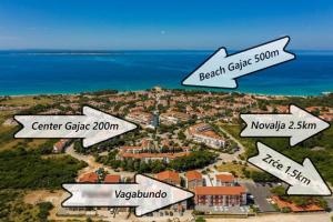a map of a resort with the ocean in the background at BUDGET RESORT Vagabundo in Novalja