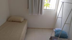 En eller flere senge i et værelse på COP 30 - apartamento 2 quartos, sala e cozinha