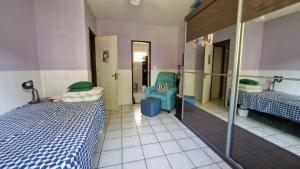 Ένα ή περισσότερα κρεβάτια σε δωμάτιο στο Chalé Paraíso do Mar +11 φωτογραφίες