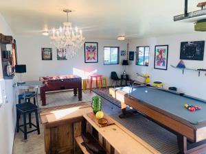 a living room with a pool table and a couch at Vogel Vacation - Spacious Secluded, Hot Tub & Game Room in Damascus