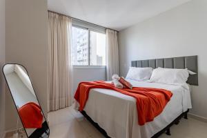 En eller flere senge i et værelse på Df plaza - apto luxo, 2 ar condicionados e suíte