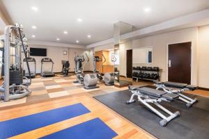 a gym with several treadmills and exercise machines at Eastgate Hotel - BW Signature Collection in Bellevue