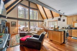 a kitchen and living room with a couch and a table at Spring Home 6 - Cozy 4BR Cabin in Black Butte Ranch w Fireplace in Black Butte Ranch