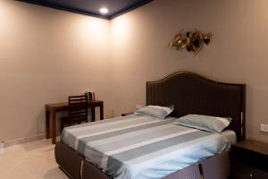 Ένα ή περισσότερα κρεβάτια σε δωμάτιο στο Annapurna Home +42 φωτογραφίες