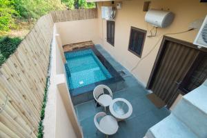 an overhead view of a swimming pool in a house at Annapurna Home in Noida
