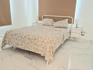 a white bed with two pillows on it in a bedroom at Villa Mar in Punta Cana +42 photos