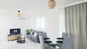 a living room with a couch and a table at Villa Mar in Punta Cana