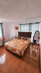 a bedroom with a large bed in a room at Apart-Hotel Katari in Arica
