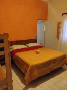 a bedroom with two beds in a room at Estrella Vladimir Hostel in Capilla del Monte