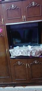 an oven with its door open with food inside at Lavande Nubian House in Aswan