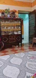 a room with a dresser with dishes on it at Lavande Nubian House in Aswan