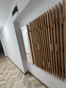a room with a wooden fence on the wall at Apartment Draganovi 8A in Kazanlŭk