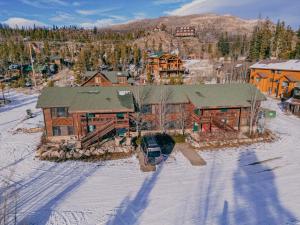 an aerial view of a house in the snow at The Loose Moose Lodge #1 At Downtown Grand Lake in Grand Lake