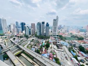an overhead view of a city with traffic and buildings at Mercu Summer Comfort Luxe Suites By KLCC in Kuala Lumpur