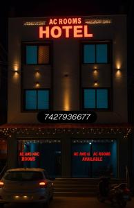 a hotel with a car parked in front of it at Shree Hanuman Hotel in Rīngas +13 photos