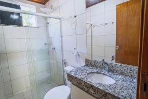 a bathroom with a sink and a toilet and a shower at Para Vos y Porque Si in Morro de São Paulo +65 photos