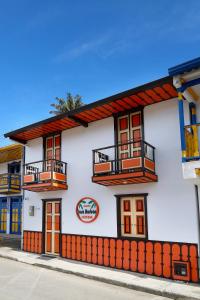 a white building with balconies on the side of it at Casa Borbon in Salento