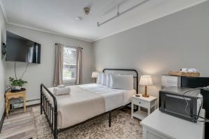 Ένα ή περισσότερα κρεβάτια σε δωμάτιο στο The Pine Street Inn