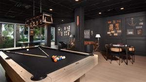 a billiard room with a pool table in it at 515 Mariners Club in Key Largo