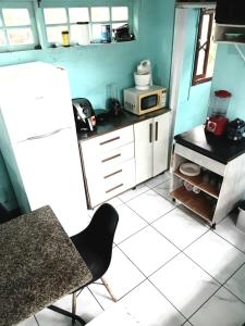 Η κουζίνα ή μικρή κουζίνα στο Recantinho da floresta +13 φωτογραφίες