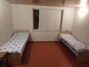 Ένα ή περισσότερα κρεβάτια σε δωμάτιο στο Parviz Guest House in Khinalig