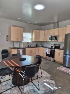 a large kitchen with a table and chairs in it at Bluff 11 Professional Housing in Delta