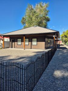 a building with a fence in front of it at Bluff 11 Professional Housing in Delta