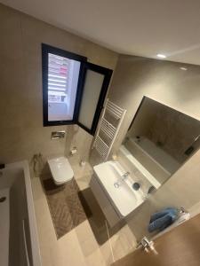 a bathroom with a sink and a toilet and a mirror at Le Relais Résistance Luxury in Sousse +21 photos