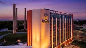 a rendering of a mgm building at dusk at Caesars Virginia, A Caesars Destination in Danville +8 photos