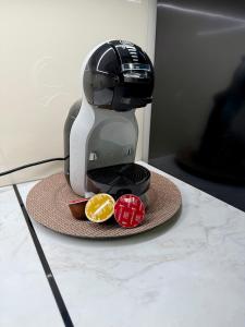 a coffee maker sitting on top of a table at Apartament Kaszmir in Kętrzyn +1 photo