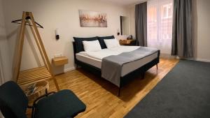 a bedroom with a large bed in a room at Eda7 Boutique Rooms in Sarajevo