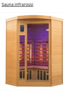 a wooden cabinet with a glass door with a window at PALAZZO NOVECENTO WELLNESS B&b in Lecco