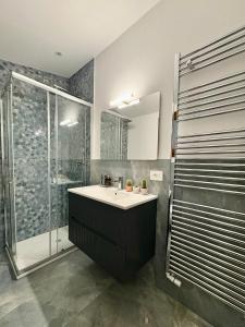 a bathroom with a sink and a shower at AB apartment Pistoia in Pistoia