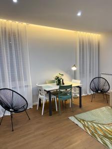 a dining room with a table and chairs at AB apartment Pistoia in Pistoia