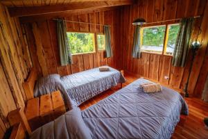 Ένα ή περισσότερα κρεβάτια σε δωμάτιο στο Cabaña la Delfina