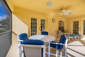a dining room with a table and chairs at 373 - Stunning 4 Bedroom Villa with own Private South East Facing Pool in Orlando