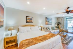 a bedroom with a bed and a living room at Maui Eldorado Resort E205 in Kaanapali +27 photos