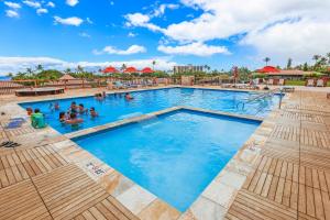 a pool at a resort with people in it at Maui Eldorado Resort E205 in Kaanapali