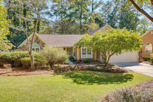a house with a tree in the yard at 2 Mi to KSU Family Home with Games, Near Parks in Kennesaw
